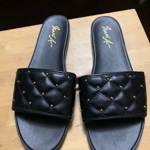 Black faux leather slides